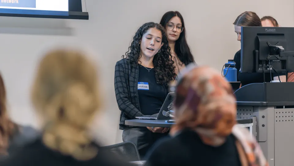 A group of students gives a slideshow presentation