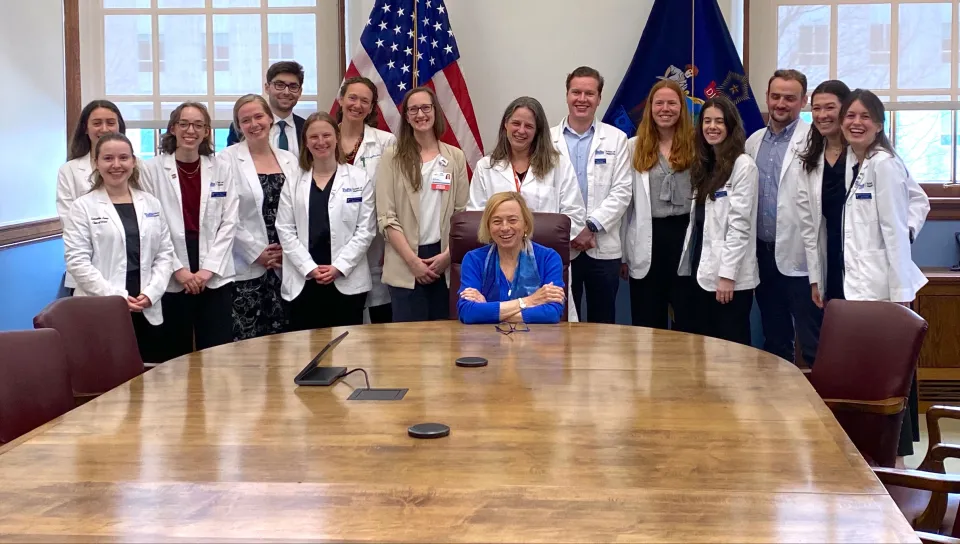 UNE and Tufts medical students pose for a group photo with Gov. Janet Mills