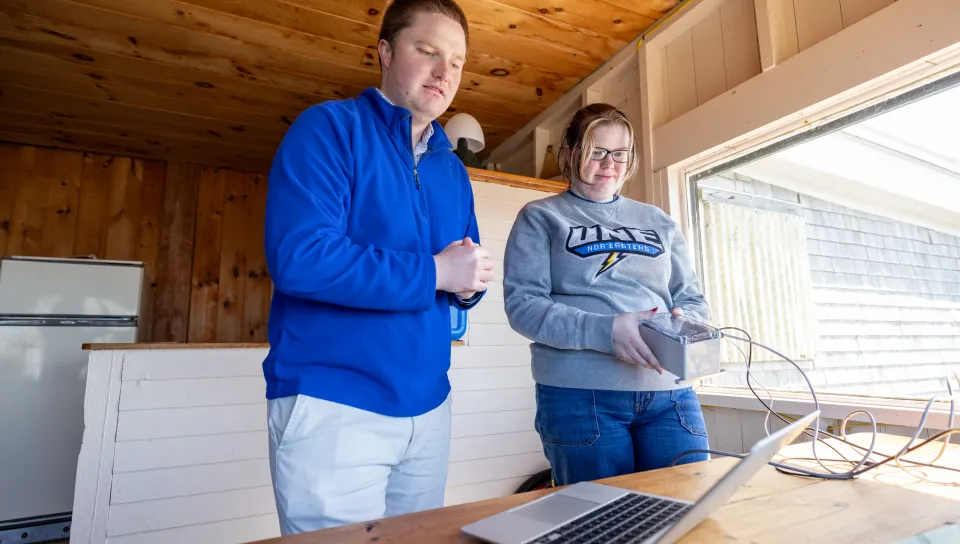 UNE team of students and faculty install seismometer on Ram Island
