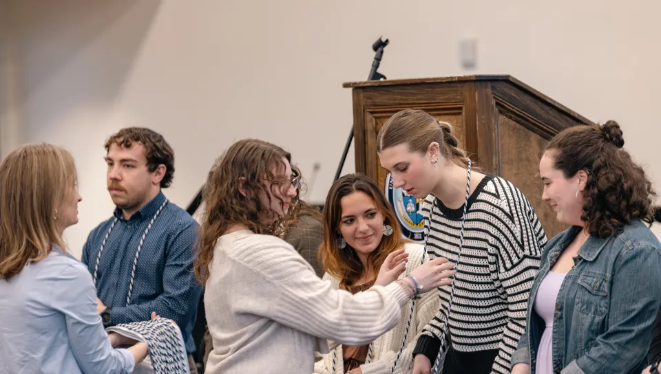 Students receive their PSI CHI graduation cords 