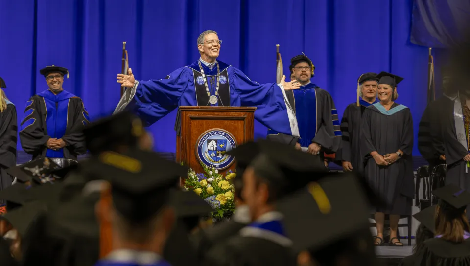 UNE President James Herbert addresses the crowd of graduates