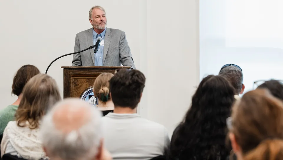 UNE North Director Cameron Wake welcomes the crowd