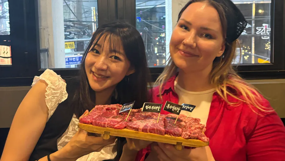Curran and a friend enjoy Korean barbecue
