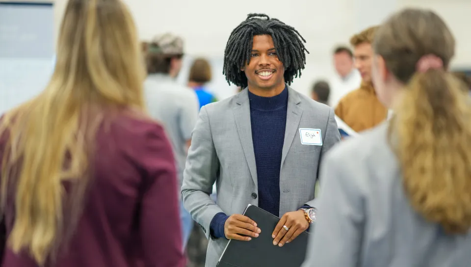 A UNE student meets with prospective employers
