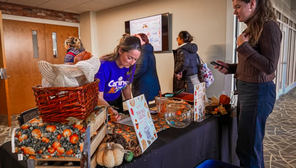 An employee takes tickets for a luncheon in Innovation Hall