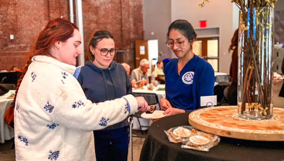 UNE students serve themselves at a lunch buffet