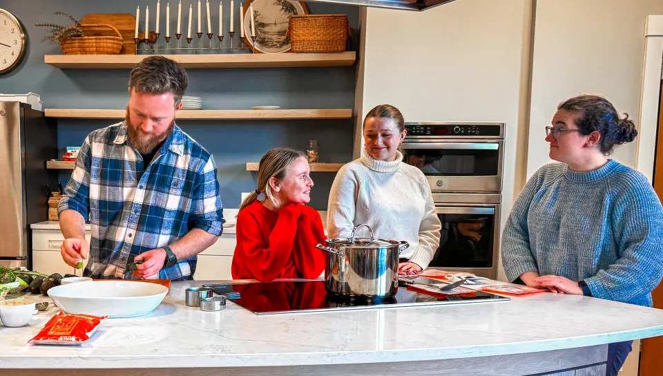 Students gather in a kitchen
