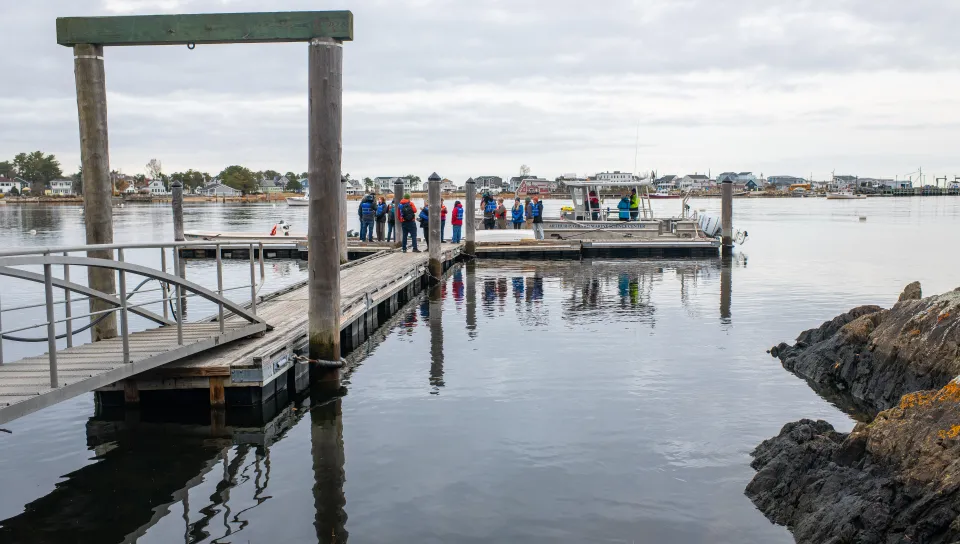 Students and faculty research gather on the UNE dock