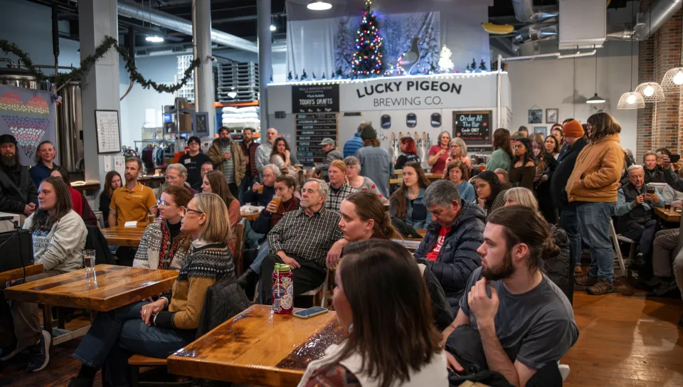 Dozens sit for presentations at a local brewery