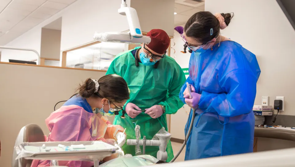 UNE dentistry and dental hygiene students provide oral health care for a pediatric patient