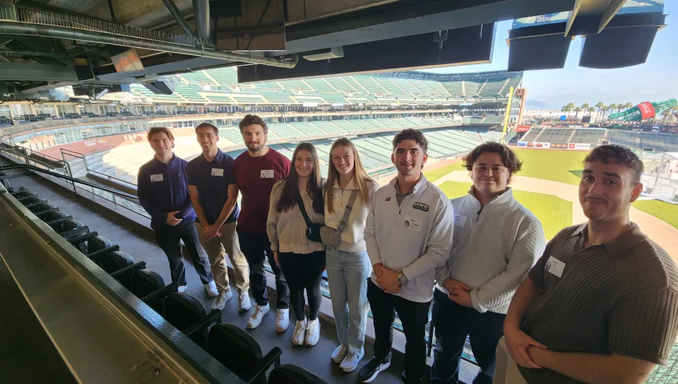 UNE students pose at Oracle Park in San Francisco