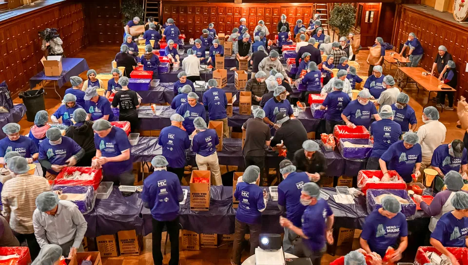 Since starting in 2023, UNE’s large-scale, meal-packaging effort had produced 300,000 meals for individuals and families throughout the state; Wednesday’s event brought that number to 350,000. The Masonic foundation joined the effort last fall to help the program reach all 16 counties in Maine for the first time.  UNE Service Learning Director Trisha Mason said in her opening remarks that the Meals for Maine partnership with the Masons typifies UNE’s experiential-learning approach to education by providing 
