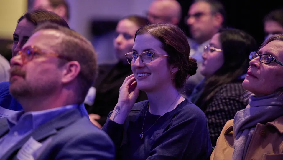 A student watches from the crowd