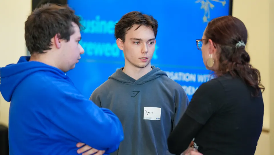 Mary Allen Lindemann chatting with students after the event