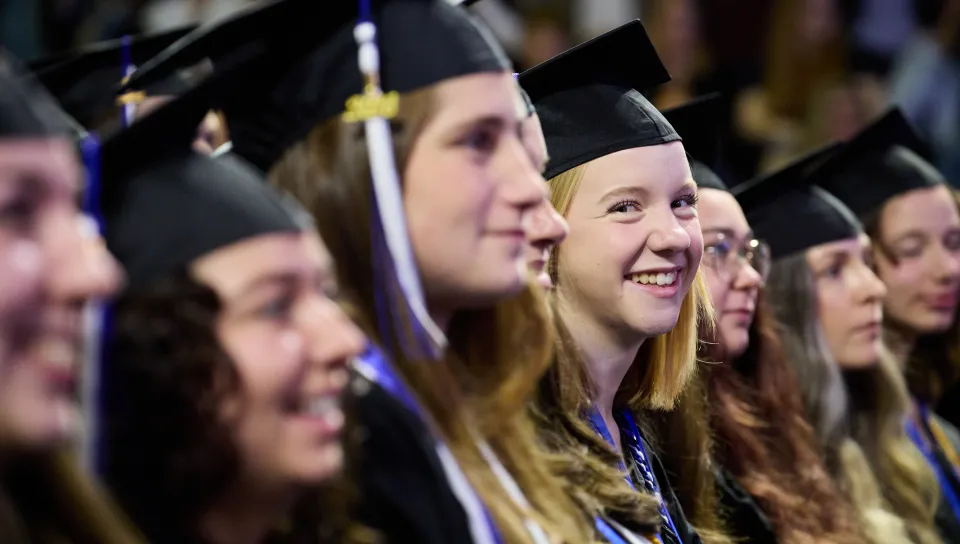 A student candid from UNE's 2026 Commencement