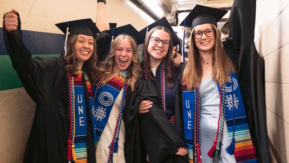 Students celebrate earning their diplomas at UNE's 2026 Commencement