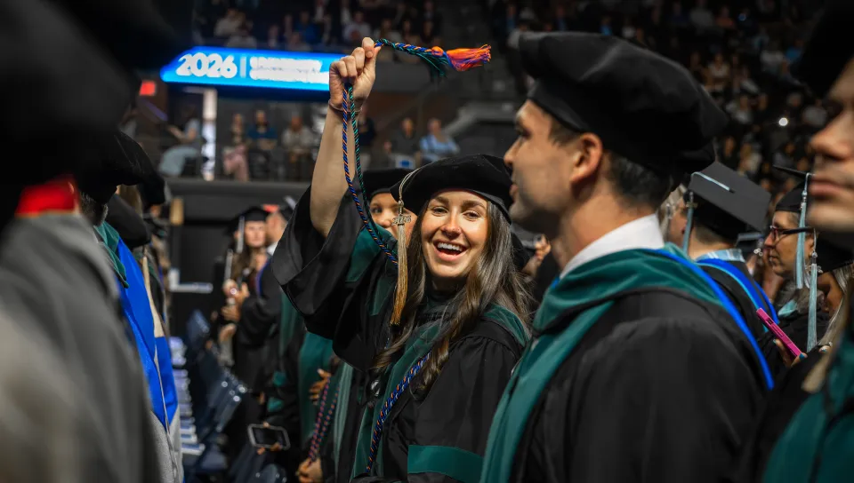 A student candid from UNE's 2026 Commencement
