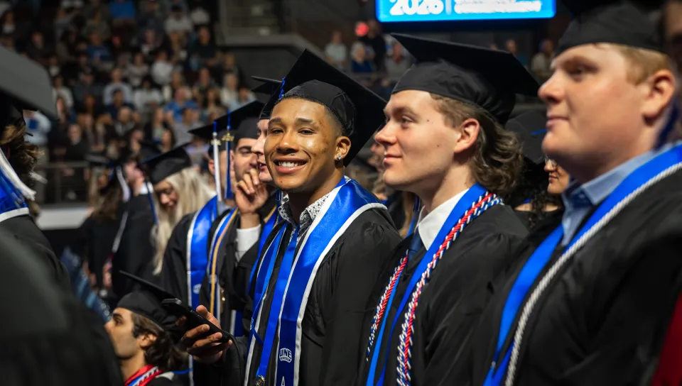 A student candid from UNE's 2026 Commencement