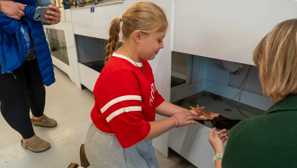 Assistant Professor Tricia Thibodeau and third-year marine science major Piper Stagg took time to lead a private tour of the Arthur P. Girard Marine Science Center for a 10-year-old aspiring researcher, carrying on a legacy of discovery throughout the next generation of scientists.
