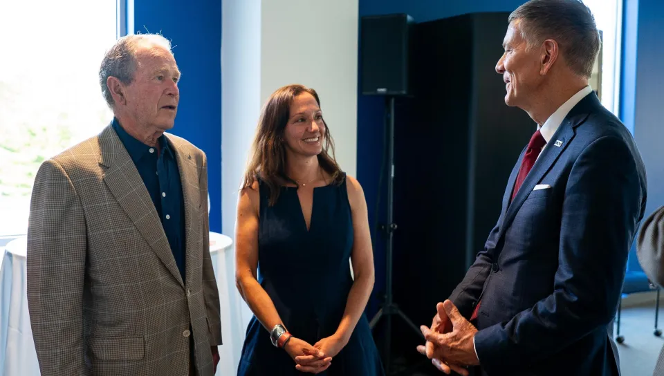 UNE President James Herbert with George W. Bush and artist