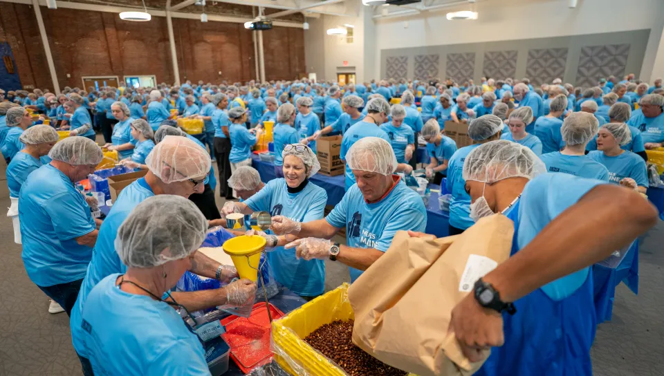 UNE, community volunteers pack a record 200,000 meal kits to combat hunger across Maine