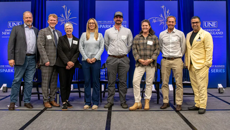 Event panelists post for a photo