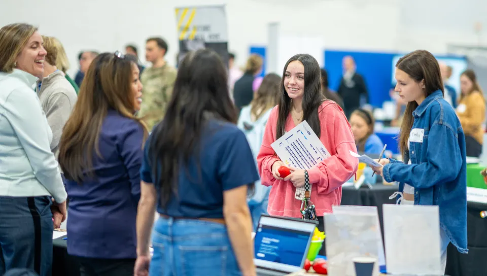 Students speak with job recruiters