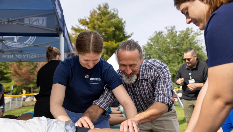 UNE students and faculty treat runners after a marathon