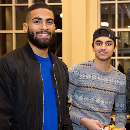 Two U N E students pose for the camera after a C G H lecture in Innovation Hall