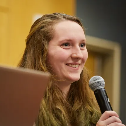 A student asks a question during a Center for Global Humanities lecture