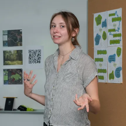 A student gives a presentation on creating a business plan