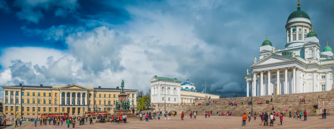 A panorama from a square featuring the University of Helsinki and a cathedral