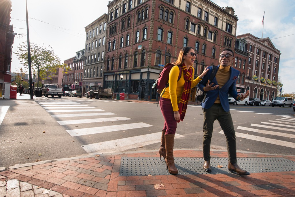 Two University of New England students walk through Portland, Maine's downtown Old Port area