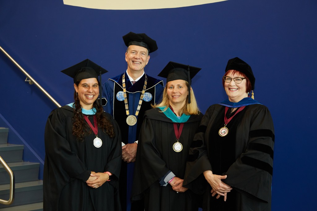 UNE President James Herbert poses with Julia Sleeper-Whiting, Hannah Pingree, and Lise Pelletier