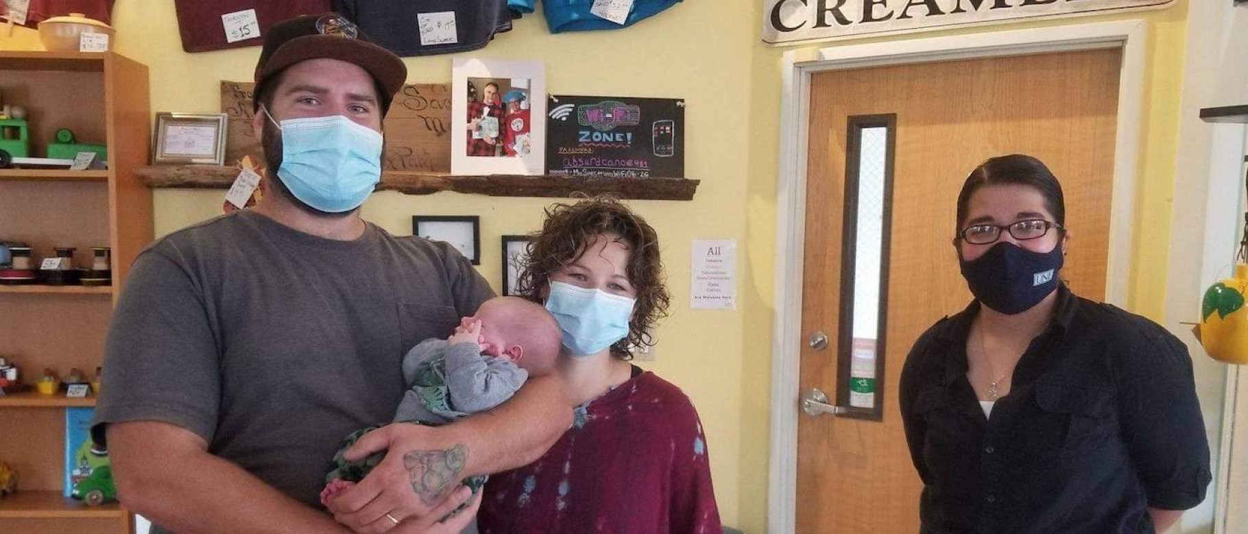 Jadin James (D.O., ’24) helped Morgan Redmond (center) when she went into sudden labor at the Saco Scoop in mid-September. Morgan's husband, Kris Redmond, is at left, holding baby Onyx. Photo courtesy of Jadin James/Saco Scoop.