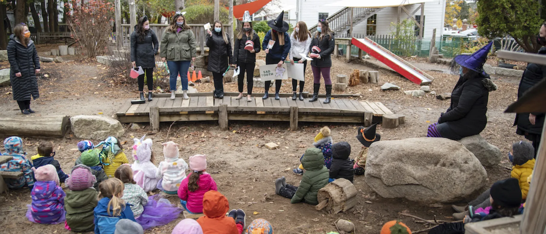 UNE Dental Hygiene students teach children the proper way to brush their teeth at the Children's Center in Portland