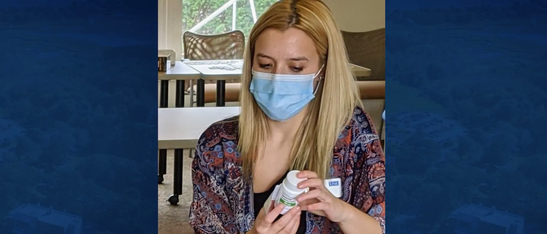 Student Alexa Michaud checks a patient's medication