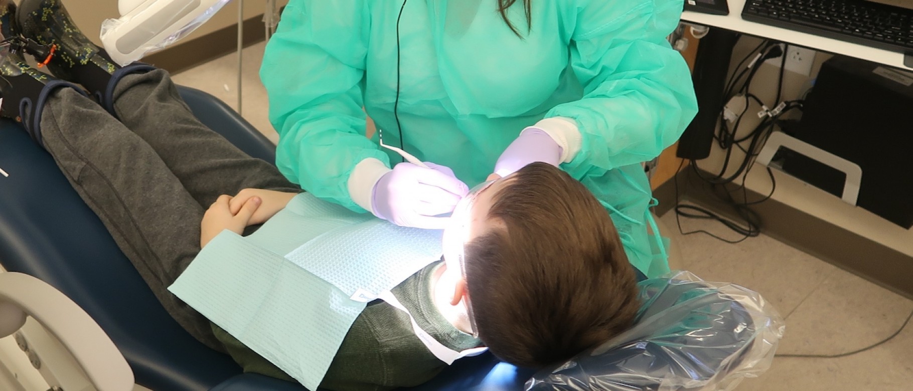 Dental student provides care to a child