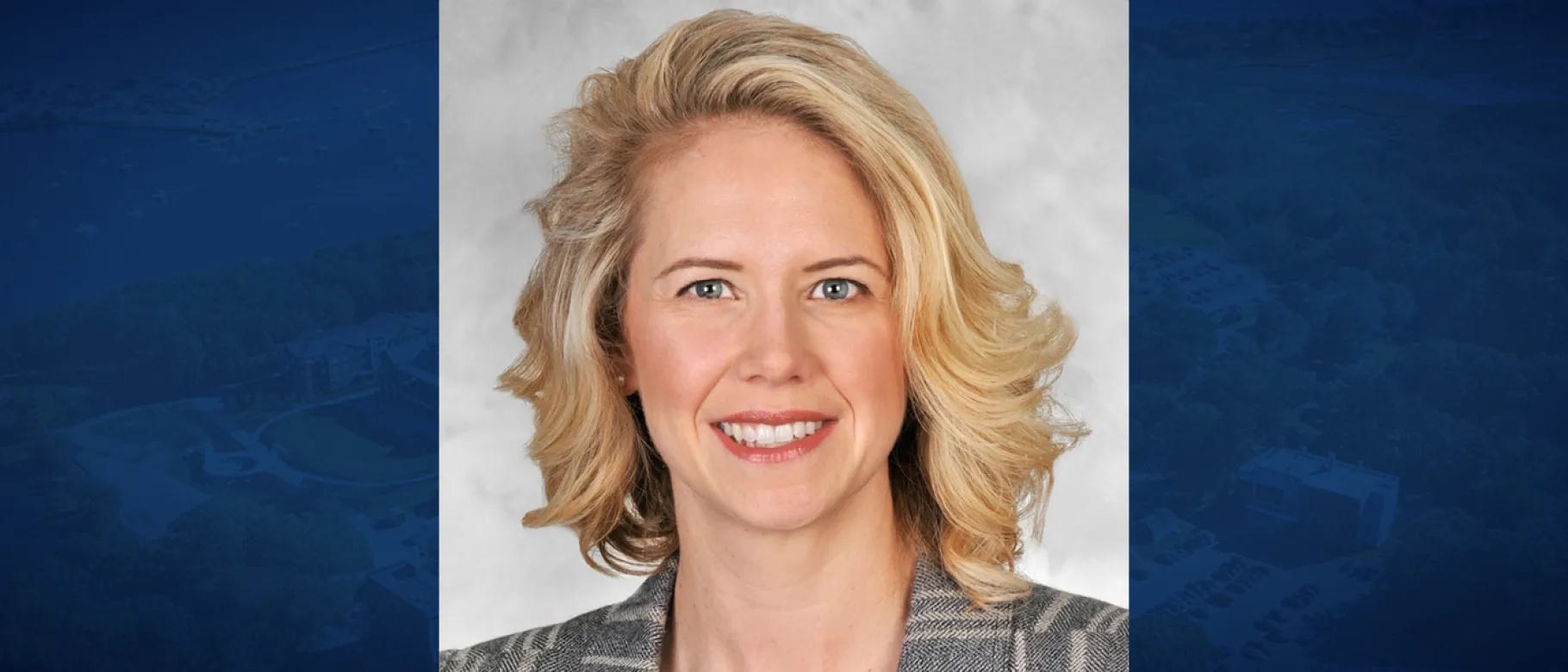 Portrait of woman, blonde, smiling at camera