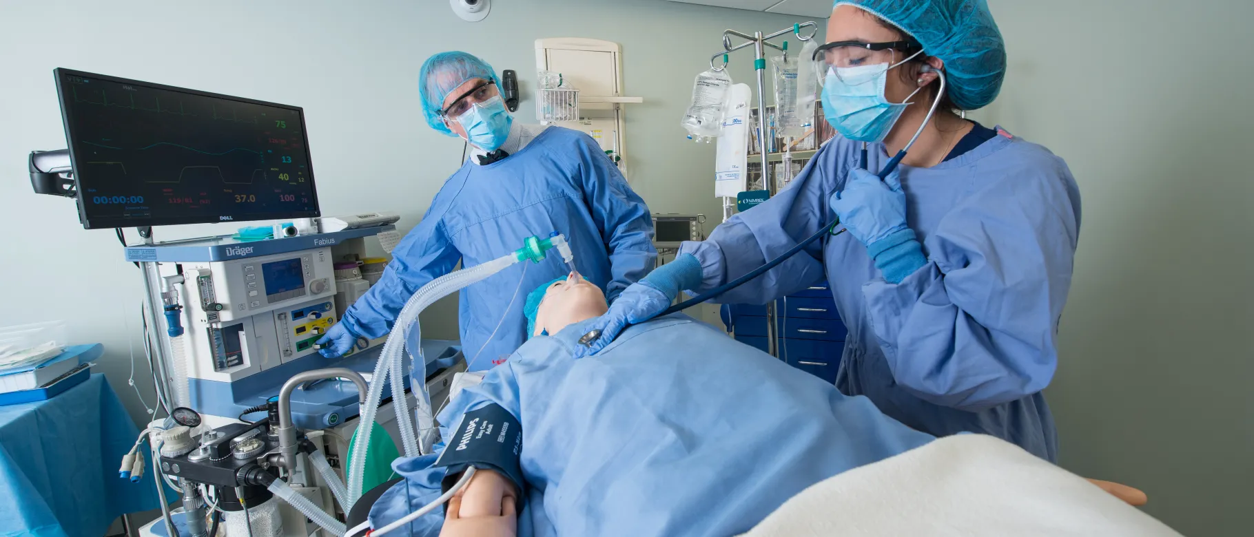 Image of nursing students tending to simulation patient