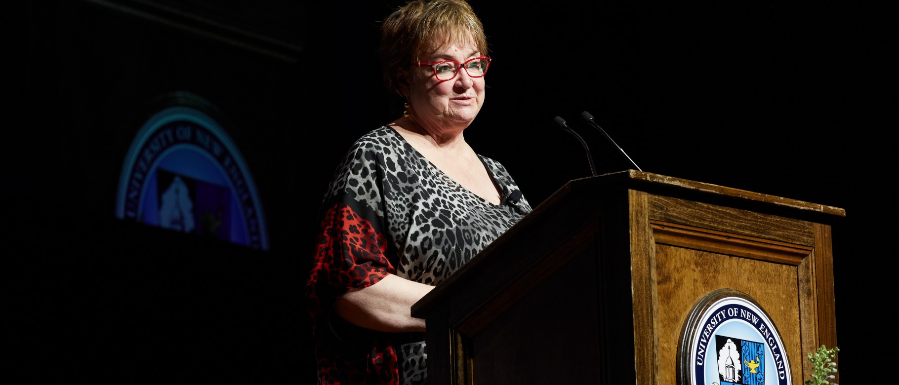 Image of woman standing at podium