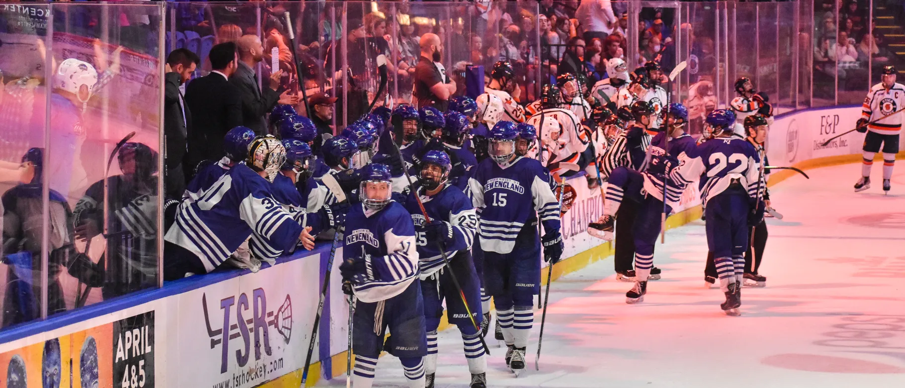 The team celebrates on the ice