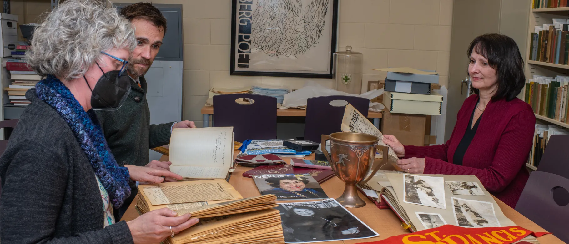 UNE archivists examine the Featherman collection