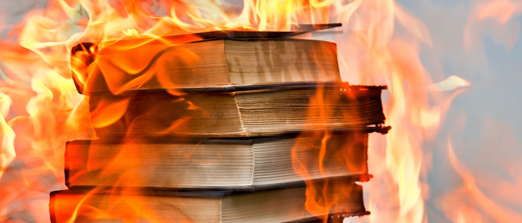 A stack of books on fire