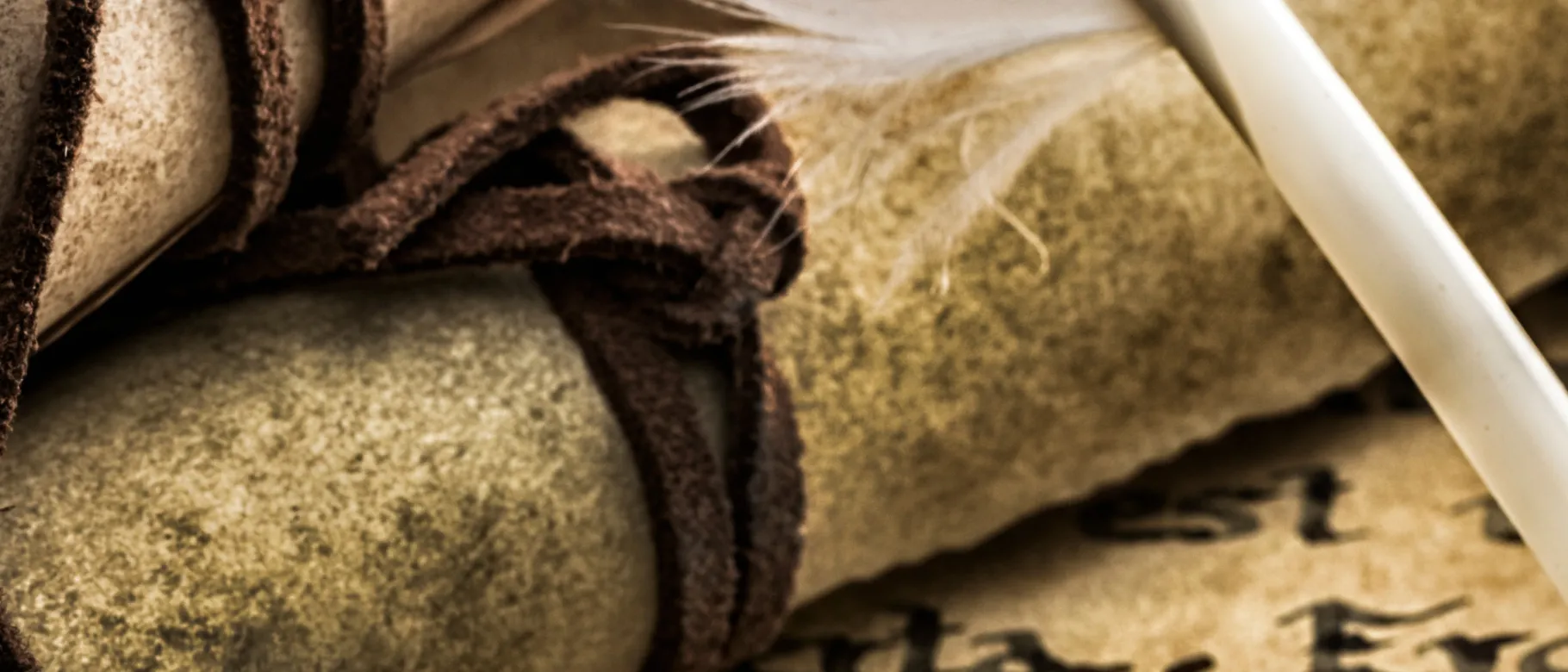 An image of a scroll and quill