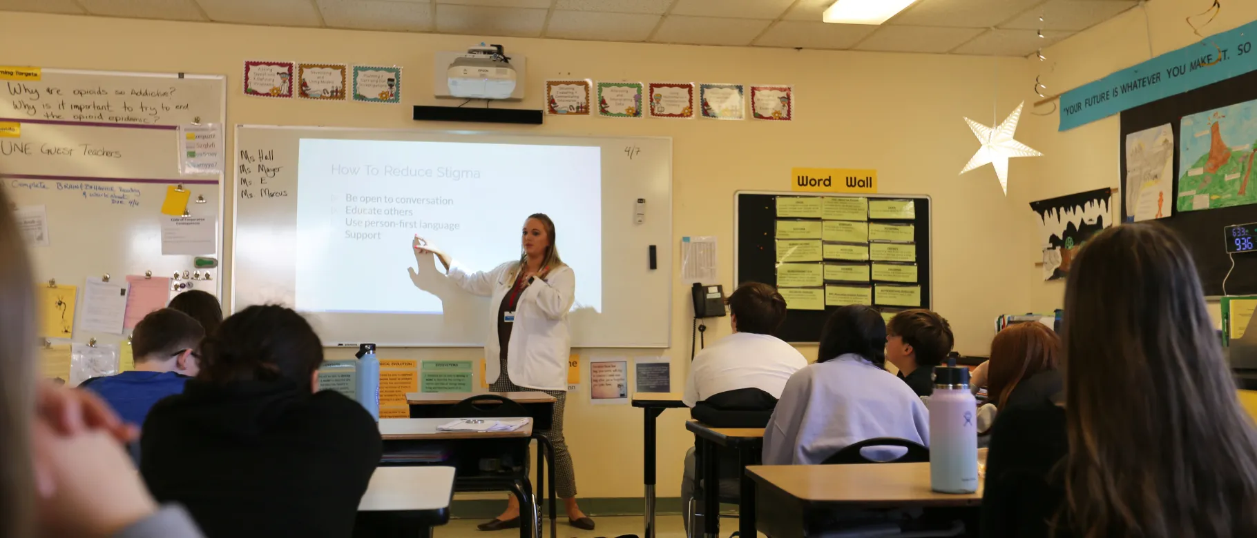 pharmacy student presenting on substance use stigma to seventh grade class
