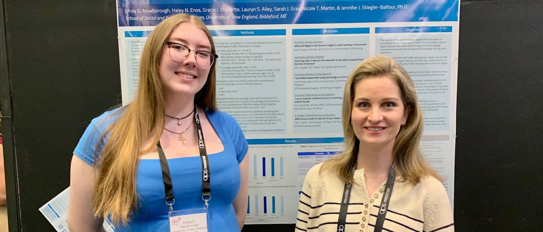 Emily Newborough poses with Jennifer Stiegler-Balfour in front of their research poster