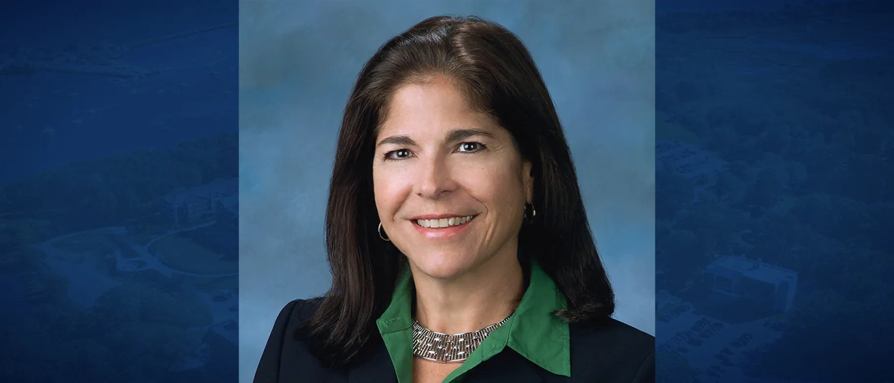 Photo of Carol Lambdin-Pattavina against a blue background