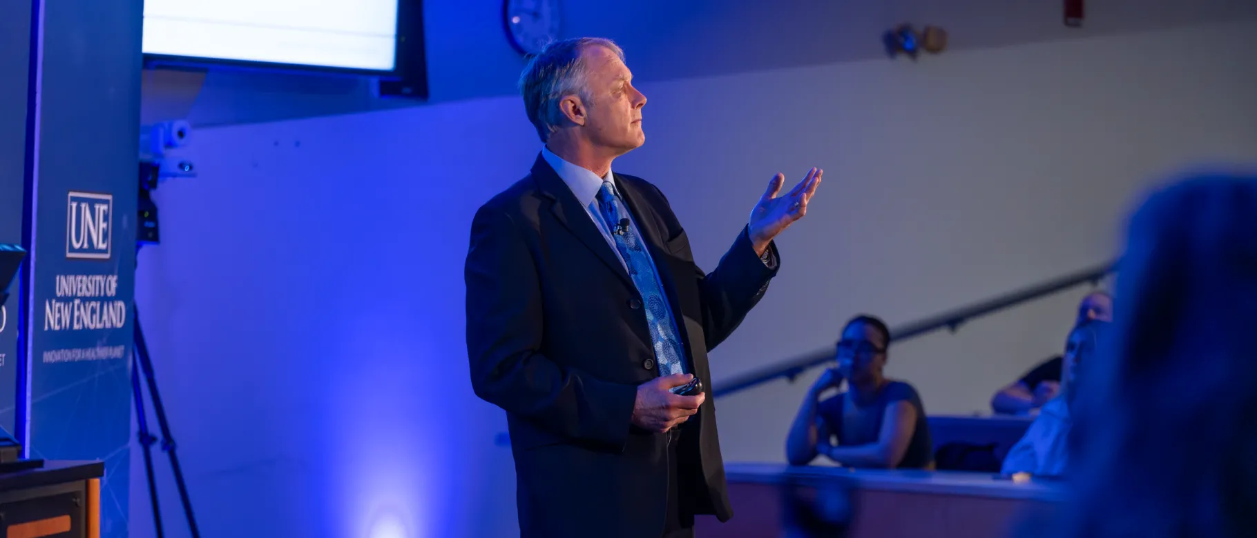 Cameron Wake addresses audience at climate talk