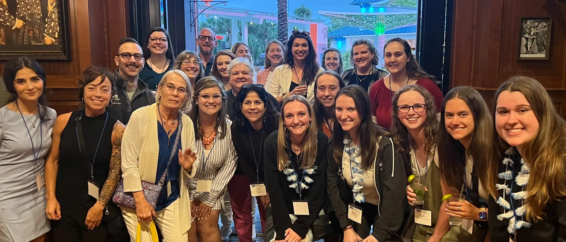 A large group of people pose for a photo at a national conference